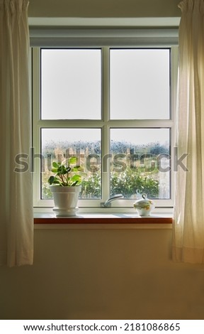 Similar – Foto Bild Ein kleines Fenster mit Gardiene in einer mit wildem Wein bewachsenen Mauer im Winter