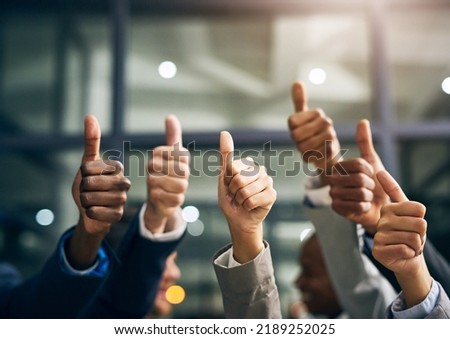 Hands showing thumbs up with business men endorsing, giving approval or saying thank you as a team in the office. Closeup of corporate professionals hand gesturing in the positive or affirmative Stock foto © 