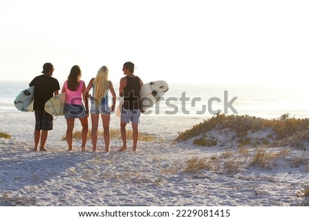 Similar – Image, Stock Photo Unrecognizable traveler on beach on cloudy day