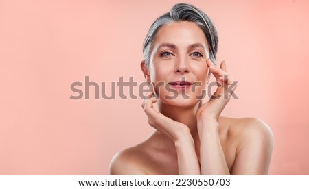 Similar – Image, Stock Photo Beautiful woman with peach standing in modern kitchen
