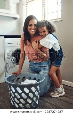 Similar – Image, Stock Photo Mother doing the laundry together with her young child