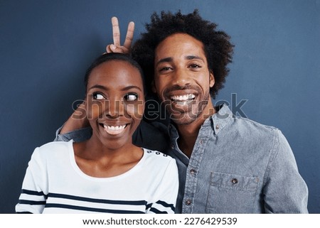 Shes my bunny. Portrait of a quirky couple on a gray background. Foto stock © 