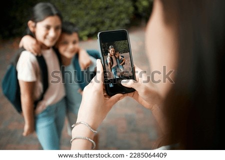 Similar – Image, Stock Photo brother taking a picture of his sister with mobile phone