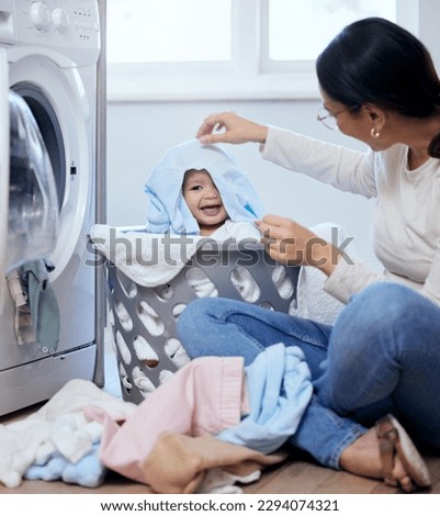 Similar – Image, Stock Photo Mother doing the laundry together with her young child