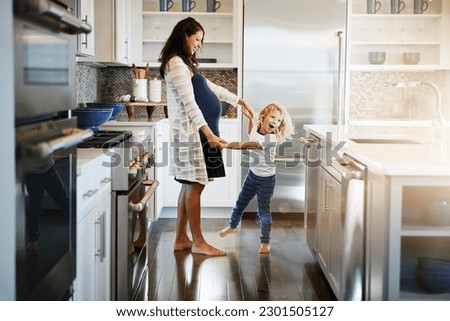 Similar – Image, Stock Photo Mother and son relaxing on the coast near the sea