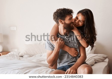 Similar – Image, Stock Photo Affectionate young couple hugging on beach