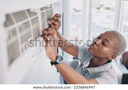 Black woman, electrician and ac repair for electrical system, fan maintenance and labor. Female mechanic, technician and engineering to fix aircon power, hvac services and air conditioning machine Stock photo © 
