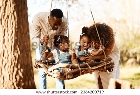 Similar – Image, Stock Photo Father and mother swinging their baby sitting on the green grass in the park. Infant is laughing happy.