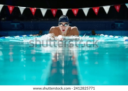 Similar – Image, Stock Photo A man swimming and diving in the water