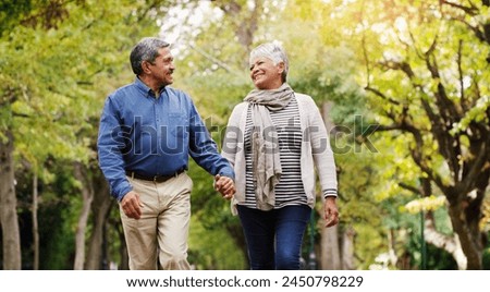 Similar – Image, Stock Photo Elderly couple walking a forest path along the seashore holding giant inflatable flamingo and unicorn. Funny active pensioners enjoying summer vacation on the beach in Northern Europe