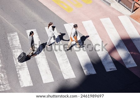 Similar – Foto Bild auf dem Zebrastreifen auf der Straße gehen.