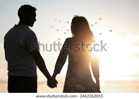 Image, Stock Photo silhouette of loving couple hugging on the lake at sunset. Beautiful young couple in love walking on the shore of the lake at sunset in the rays of bright light. copy space. selective focus