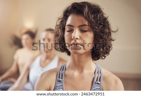 Similar – Image, Stock Photo Group of calm focused women and men practicing yoga with trainer standing in balance pose and stretching body in studio