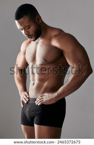 Similar – Image, Stock Photo Serious shirtless black man with makeup and flowers