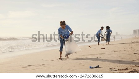 Similar – Image, Stock Photo Young woman cleaning beach area and showing plastic bottle lids in hand