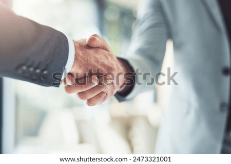 Similar – Image, Stock Photo Handshake of business people. Man and woman shaking hands in office. Two people greeting at work. Collaborative teamwork