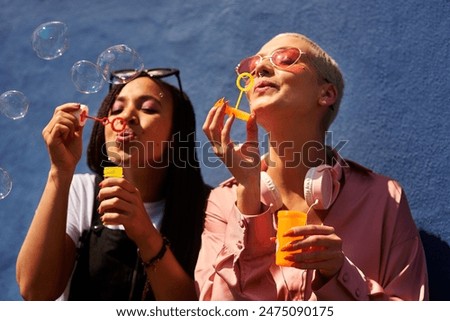 Similar – Image, Stock Photo Playful trendy woman on street in sunshine covering camera with hands