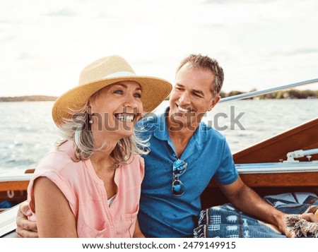 Similar – Image, Stock Photo Loving couple in boat. Top view of beautiful young couple embracing and smiling while lying in the boat.