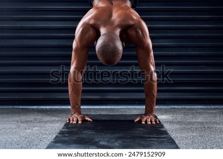 Similar – Image, Stock Photo Strong man performing handstand on sports ground