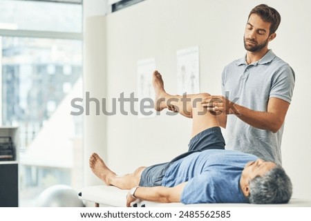 Image, Stock Photo Physiotherapist stretching leg of patient in medical room