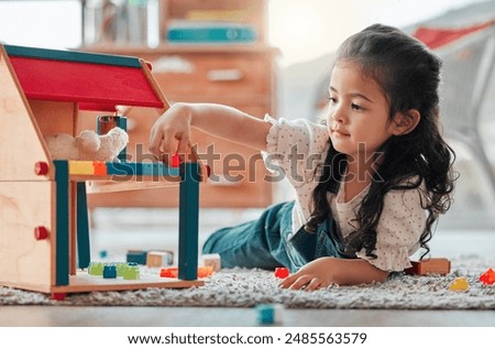 Similar – Image, Stock Photo Baby playing alone with toys on a carpet on the floor at home