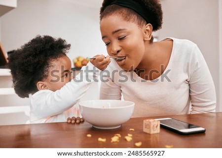 Similar – Image, Stock Photo Mother feeding child at home
