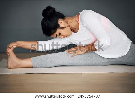 Similar – Image, Stock Photo Flexible female sitting in boat pose during yoga workout