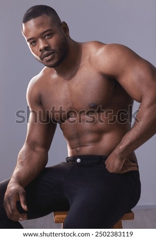 Similar – Image, Stock Photo Serious shirtless black man with makeup and flowers
