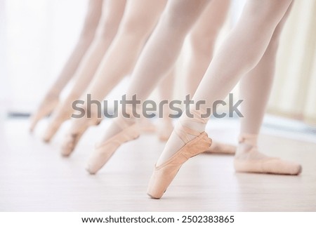 Image, Stock Photo Ballerina in ballet pointe stretches on barre in gym. Woman practicing in dance studio. Work out of young girl.