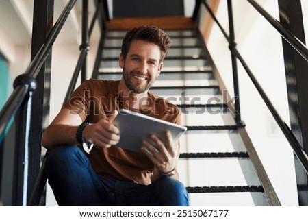 Man, office and portrait with tablet in staircase for creative idea, research and project as interior designer. Business, male employee and smile in startup on for communication and networking