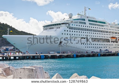 PHILIPSBURG, ST. MAARTEN - JAN.16: Cruise ships docked on the Dutch side of St. Maarten on Jan. 16, 2013.  Philipsburg is one of the busiest islands as the port can accommodate half dozen ships.