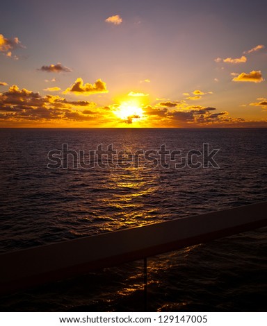 Golden sunset, seen from the balcony of a boat