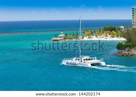 OCHO RIOS, JULY 14:  A large catamaran heading out to the Caribbean Sea on July 14, 2011. Cool Runnings Catamarans offers daily cruises to the famous Dunn\'s River Falls in Ocho Rios, Jamaica.