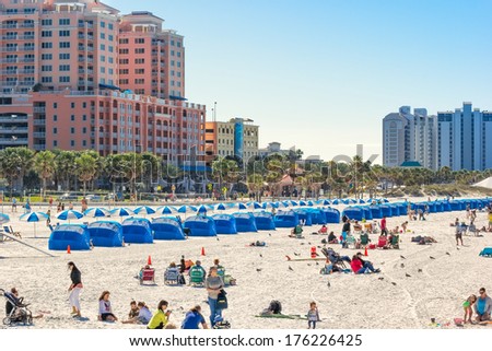 CLEARWATER, FLORIDA - FEB. 8, 2014:  Beach goers enjoy a day on Clearwater Beach, recently renovated and named one of the best beaches in Florida.