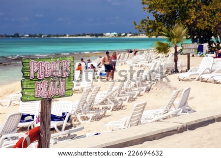 GRAND CAYMAN, CAYMAN ISLANDS - MARCH 8, 2013:  Pebble Beach, one of many small beaches that the Cayman Islands has to offer the tourists that vacation on the western Caribbean island.