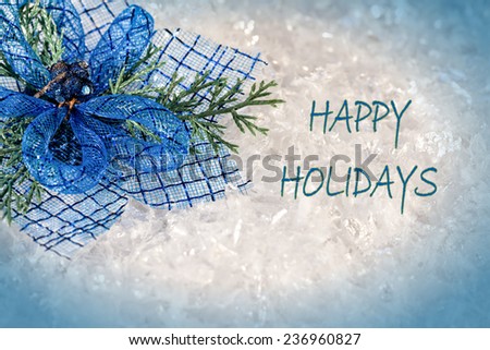 Happy Holidays greeting card with blue ornament and text