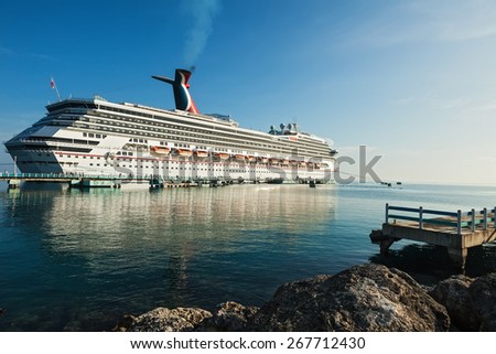 OCHO RIOS, JAMAICA - JULY 14, 2011:  Carnival Cruise Lines ship, The Carnival Freedom, docks in the favorite Caribbean destination of Ocho Rios, Jamaica.
