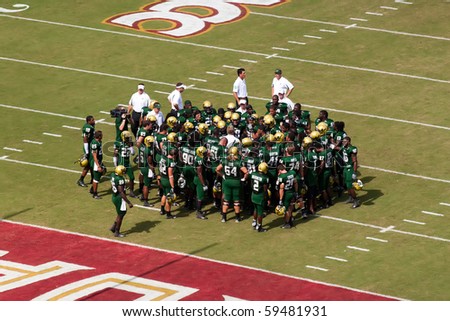 TALLAHASSEE, FL - SEPTEMBER 26:  University South Florida gather for coach pep talk before game against Florida State at Doak Campbell Stadium September 26, 2009 in Tallahassee, Florida.