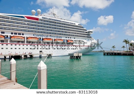 KEY WEST, FL - JULY 11:  Carnival Freedom arrives in Key West, FL on July 11, 2011. Over 660,000 cruise ship passengers visit Key West every year to enjoy galleries, shops, and famous bar and grills.