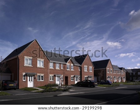 Modern new build street scene of terrace houses in the UK
