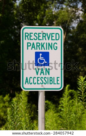 Reserved handicapped parking sign indicating space is van accessible.