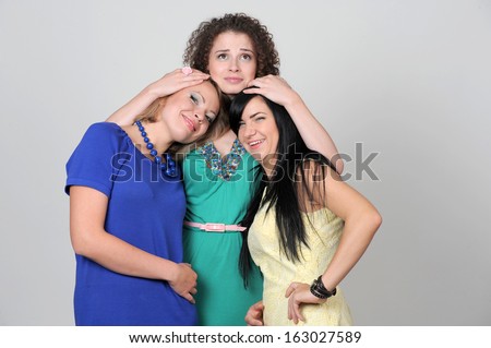 young girls emotionally liberated embrace expressing the pleasure being photographed in front of the camera