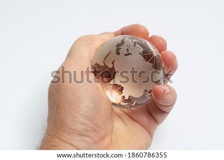 Similar – Image, Stock Photo Male hand holding globe in a plastic bag. Contaminated Earth