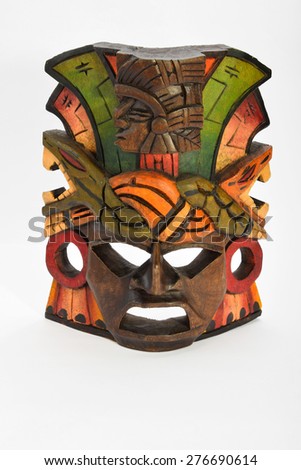 Indian Mayan Aztec wooden mask with anaconda and jaguar isolated on white background (full face vertical layout, upper angle, upper take)