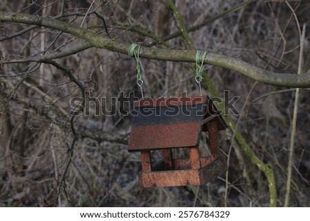 Similar – Foto Bild Am Baum hängendes Vogelhaus mit dem kreisförmigen Eingangsloch