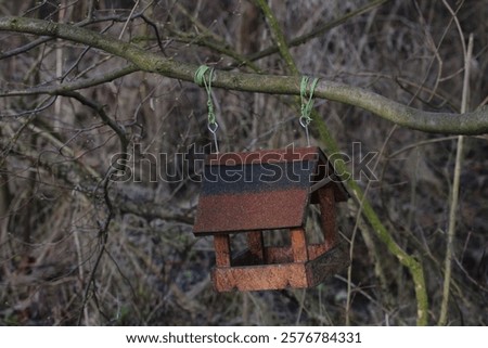 Similar – Foto Bild Am Baum hängendes Vogelhaus mit dem kreisförmigen Eingangsloch