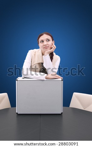 confident young business woman standing with metal case