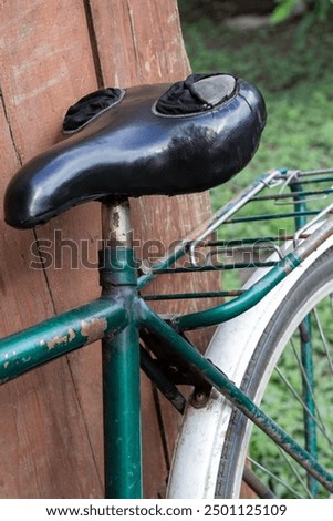 Similar – Image, Stock Photo Old bicycle saddle with visible springs and rust