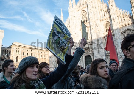 Milan, January 10, 2015 - A copy of the French satirical newspaper Charlie Hebdo raised to the sky during the demonstration in solidarity with the French people after the terroristic attack in Paris