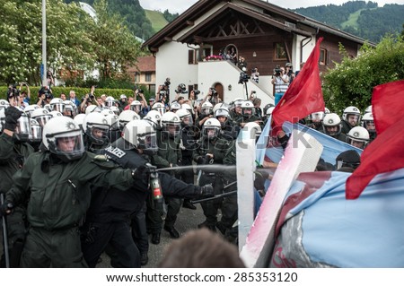 GARMISCH-PARTENKIRCHEN, GERMANY - JUNE 06: Police officers scuffle with anti-G7 protesters. G7 leaders will meet at nearby Schloss Elmau on June 7-8